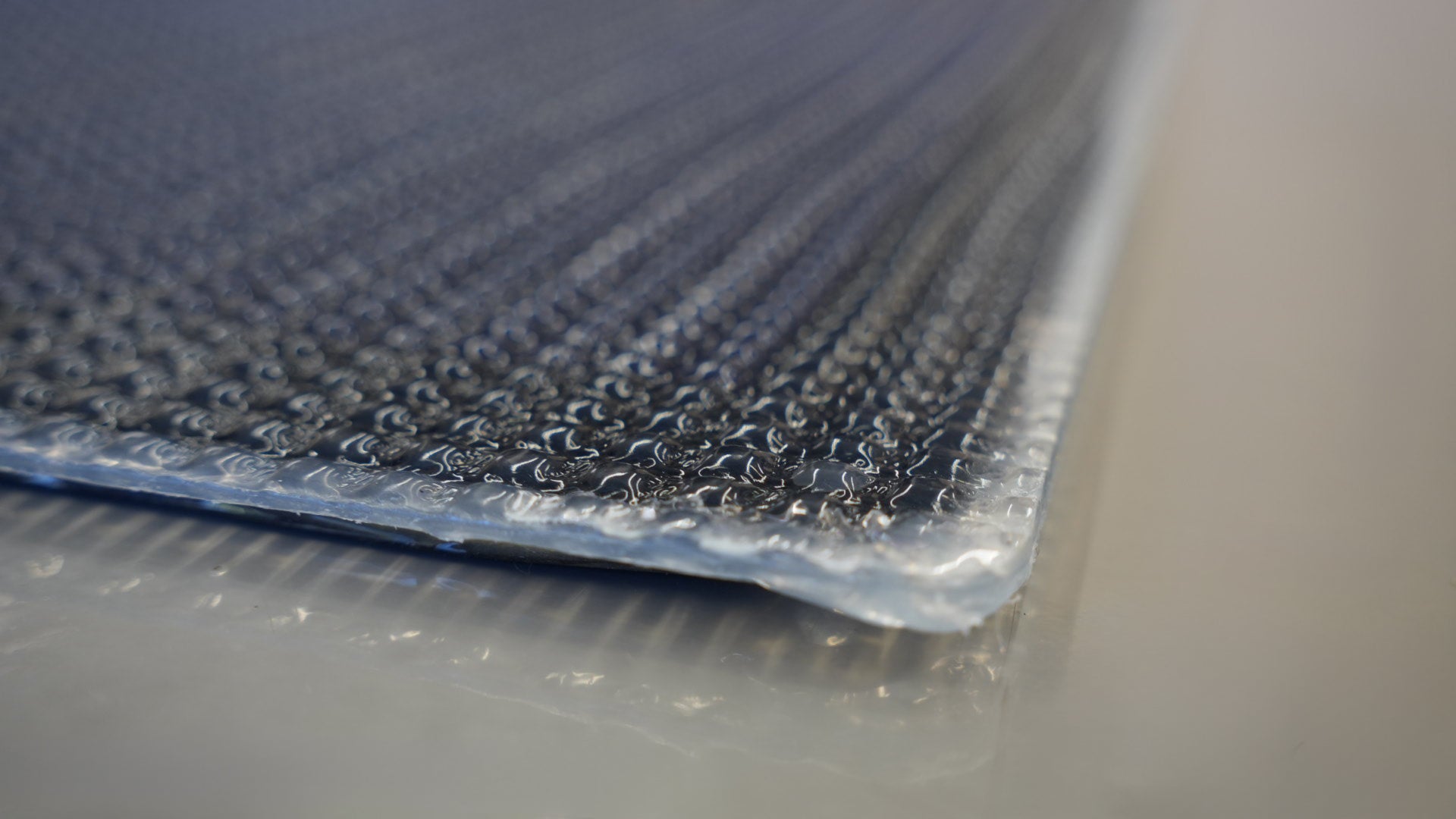 Walkable Carbon Solar Panel designed for high-efficiency power in Sprinter and Transit campervans, RVs, and off-grid setups. Ideal for van conversions and marine environments, this lightweight and durable panel features an ETFE surface and is built to withstand diverse weather conditions for reliable energy on the go.